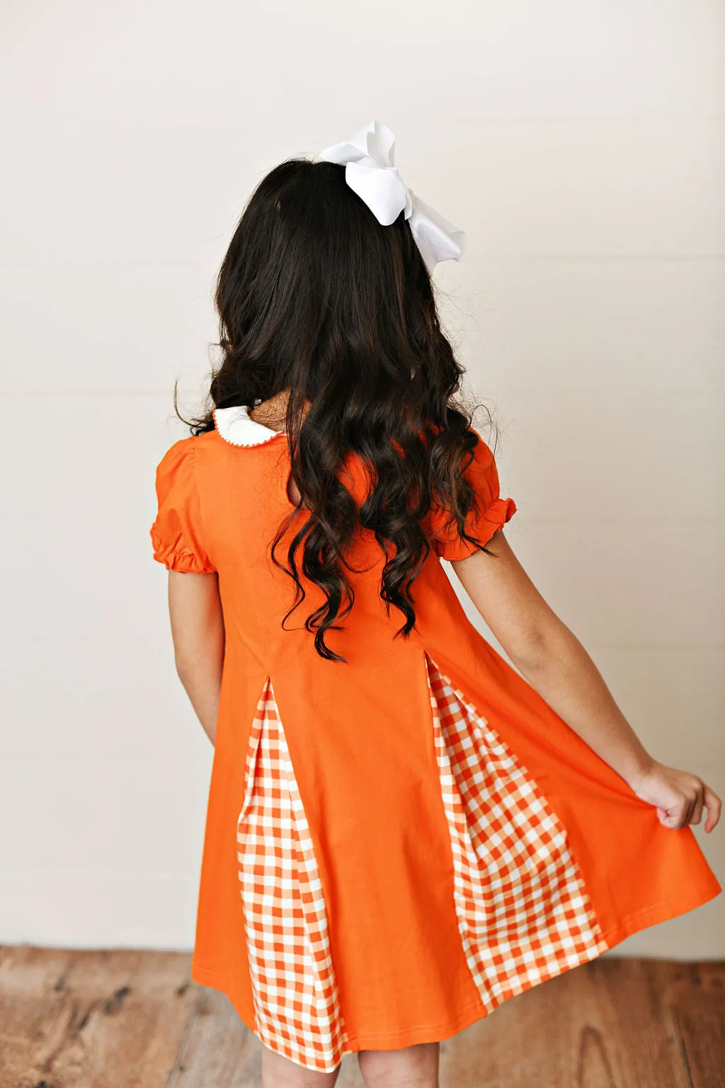 Orange gingham pleat dress